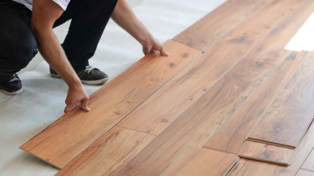 Flooring Contractor Installing Laminate Planks